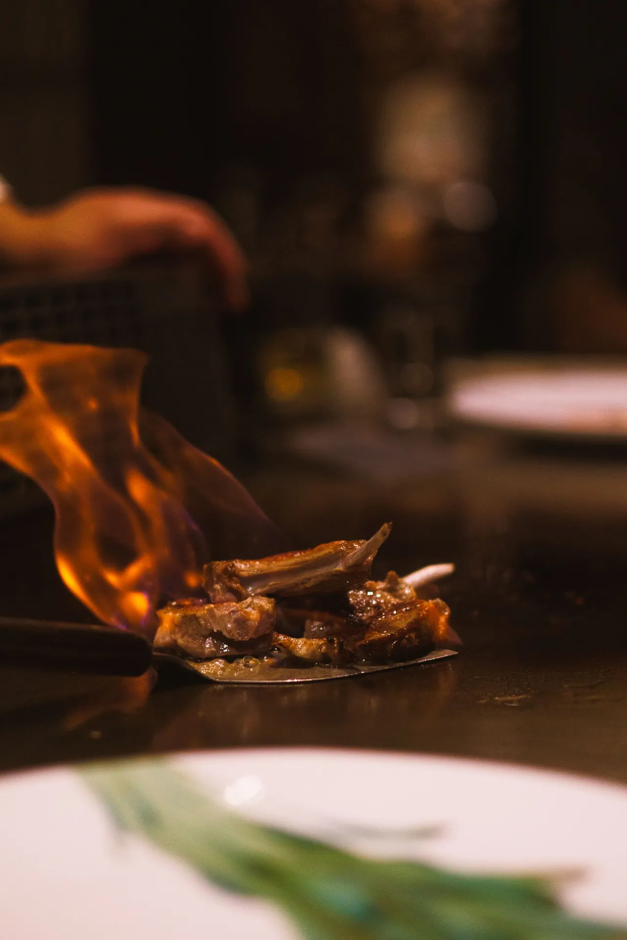 A chef grilling over an open flame