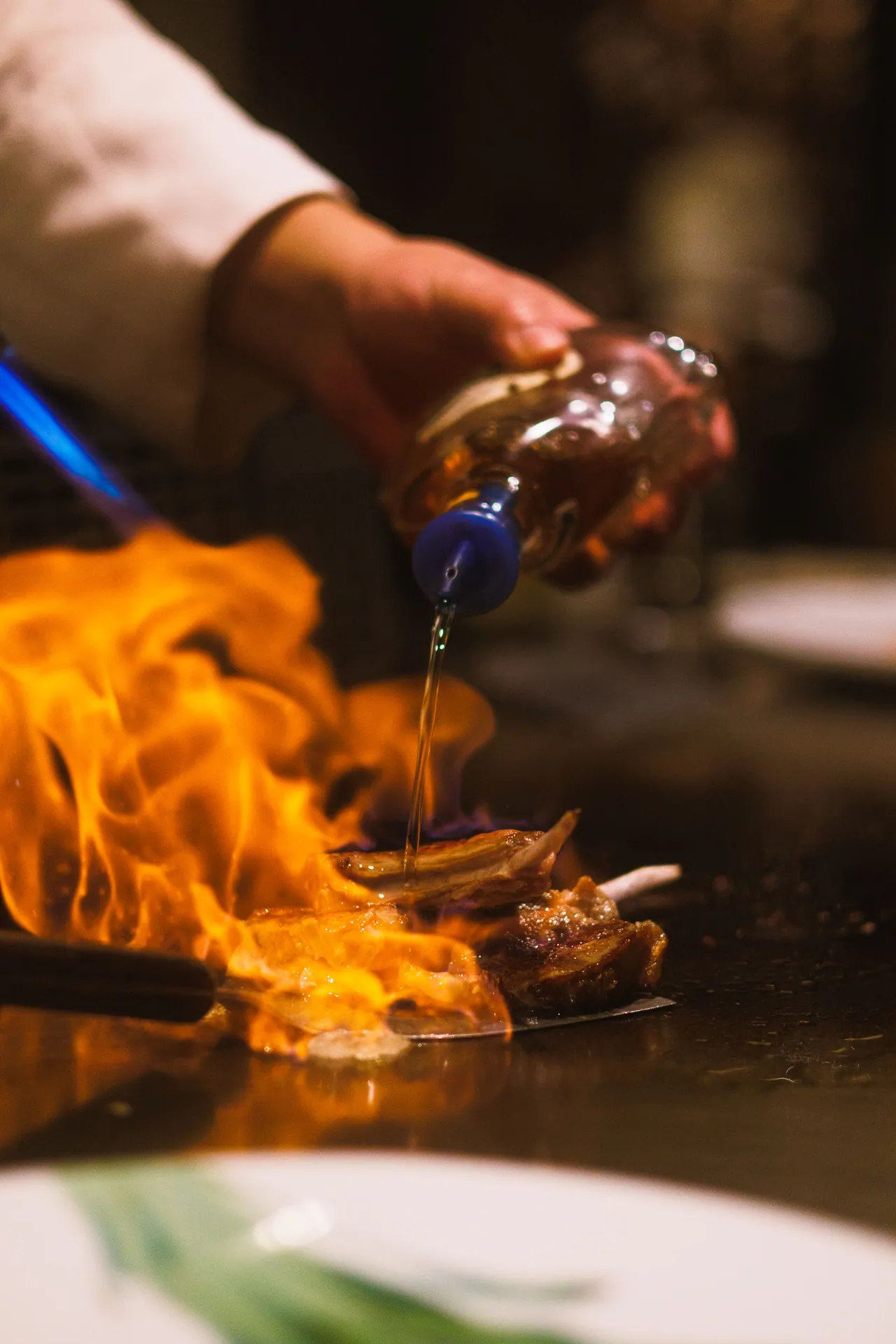 Dynamic teppanyaki cooking with flames